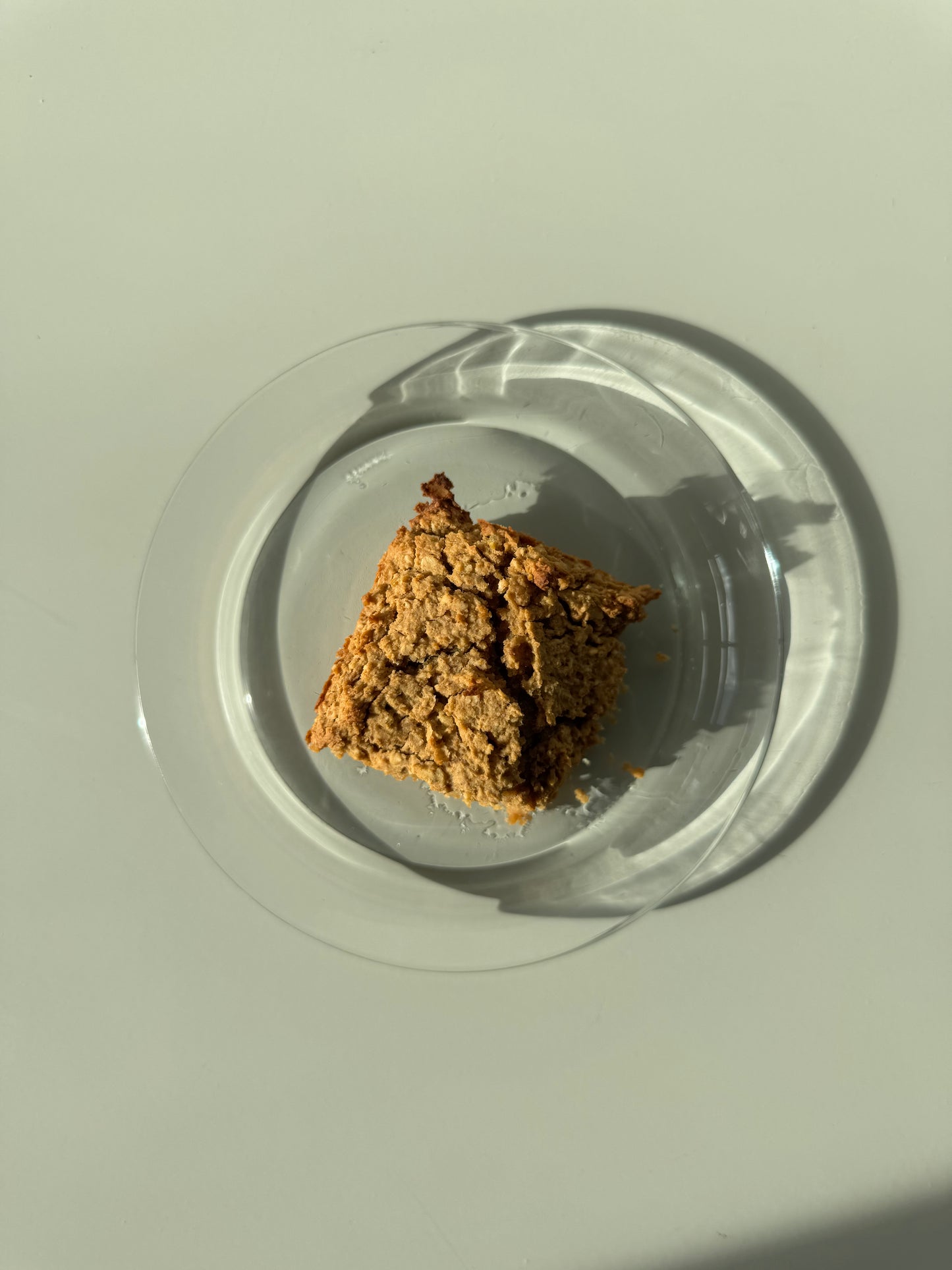 A plate with several peanut butter chocolate chip blondies, naturally sweetened treats.