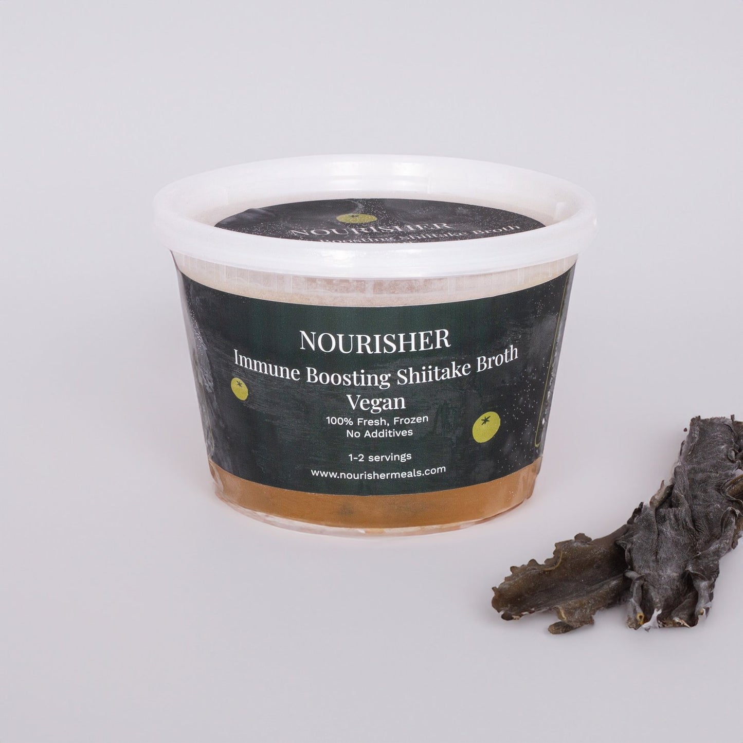 A packaged unit of Shiitake Immune Boost broth with visible leeks.