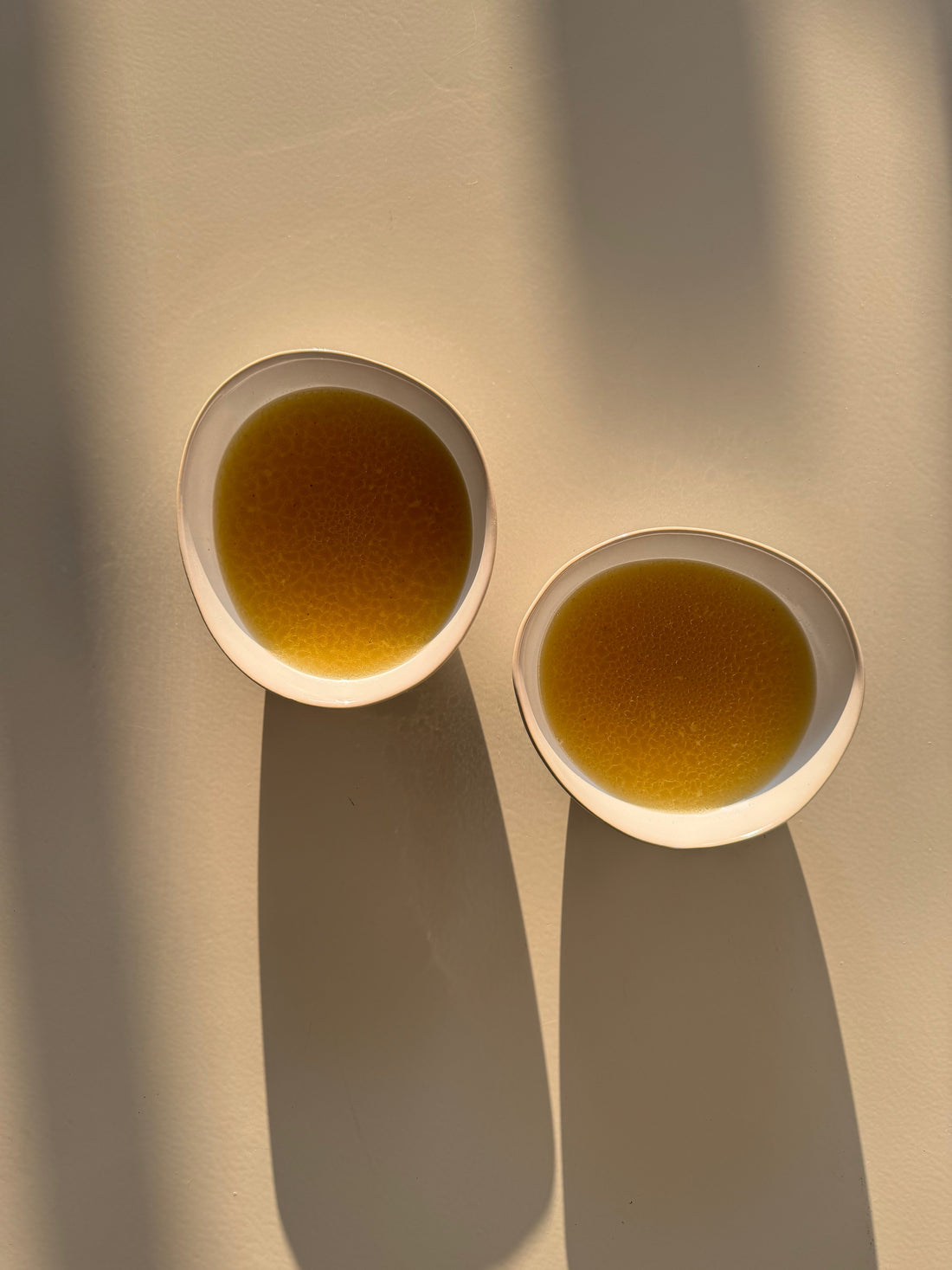 Bone broth in a ceramic bowl, ideal for postpartum healing meals