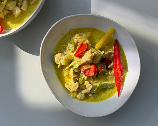white ceramic bowl with lemongrass coconut chicken meal