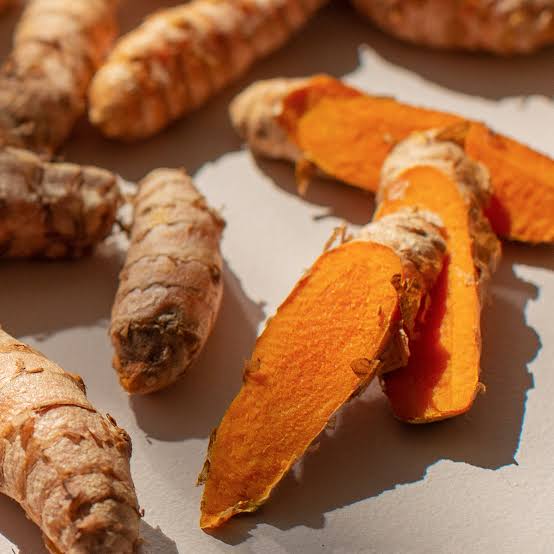 Ginger and turmeric postpartum healing tea in a warm mug