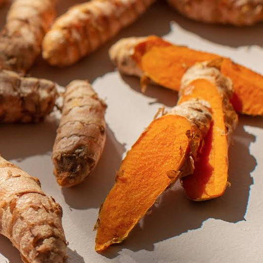 Ginger and turmeric postpartum healing tea in a warm mug