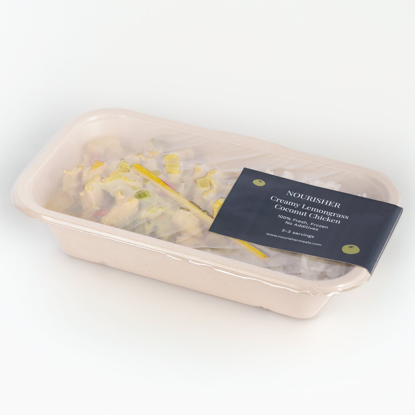 One package of Creamy Lemongrass Coconut Chicken, garnished with herbs and spices, served on a white plate.