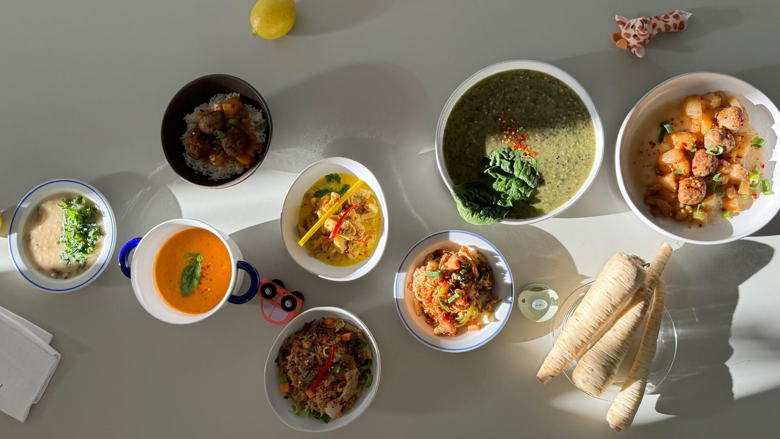 Top-down view of various dishes on a gray surface